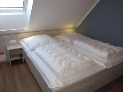 Ein Bett oder Betten in einem Zimmer der Unterkunft Holiday Home Cuxland Ferienpark-5 by Interhome