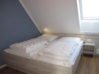 Ein Bett oder Betten in einem Zimmer der Unterkunft Holiday Home Cuxland Ferienpark-5 by Interhome