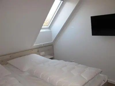 Ein Bett oder Betten in einem Zimmer der Unterkunft Holiday Home Cuxland Ferienpark-5 by Interhome
