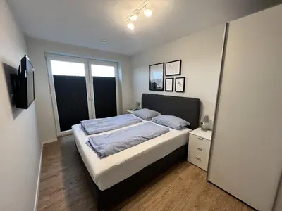 Ein Bett oder Betten in einem Zimmer der Unterkunft Quartier Hohe Geest 18 - Strandzeit - a69837