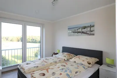Ein Bett oder Betten in einem Zimmer der Unterkunft Quartier Hohe Geest 17 - Nord Seestern - a69854