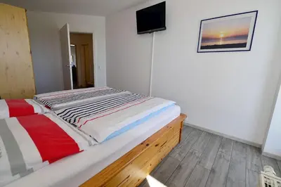 Ein Bett oder Betten in einem Zimmer der Unterkunft Haus Nordseebrandung NC35