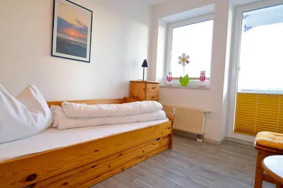 Ein Bett oder Betten in einem Zimmer der Unterkunft Haus Nordseebrandung NC35