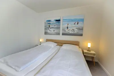 Ein Bett oder Betten in einem Zimmer der Unterkunft Haus Baltic BA03