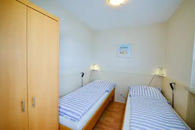 Ein Bett oder Betten in einem Zimmer der Unterkunft Am Sahlenburger Strand AS12