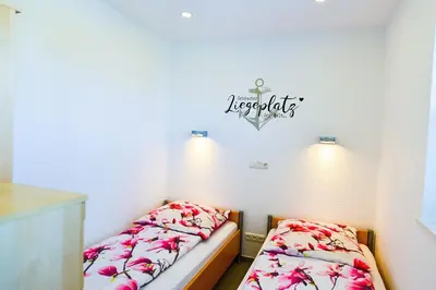 Ein Bett oder Betten in einem Zimmer der Unterkunft Am Sahlenburger Strand AS16