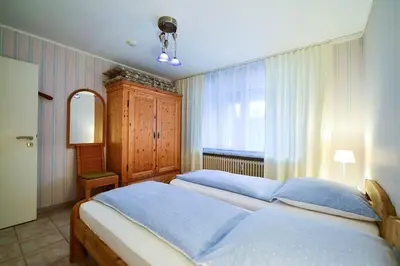 Ein Bett oder Betten in einem Zimmer der Unterkunft Haus Heidhöhn Nr 4 HE04