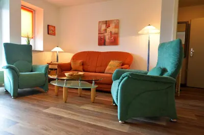Ein Sitzbereich in der Unterkunft Haus Nordseebrandung NB26