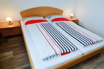 Ein Bett oder Betten in einem Zimmer der Unterkunft Haus Nordseebrandung NB26