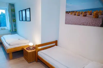 Ein Bett oder Betten in einem Zimmer der Unterkunft Haus Nordseebrandung NB44
