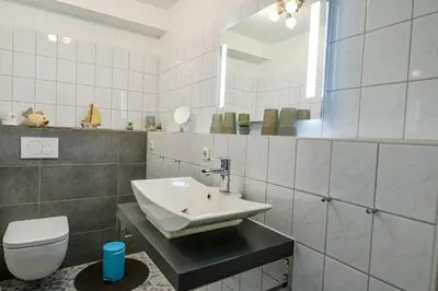 Ein Badezimmer in der Unterkunft Haus Nordseebrandung ND12