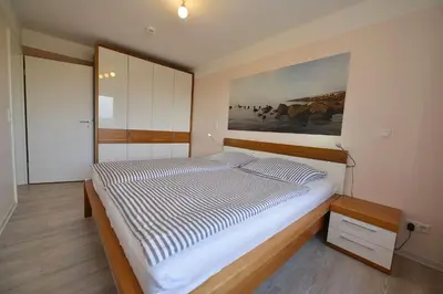 Ein Bett oder Betten in einem Zimmer der Unterkunft Haus Nordseebrandung ND41