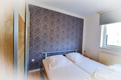 Ein Bett oder Betten in einem Zimmer der Unterkunft Haus Seewind HS19