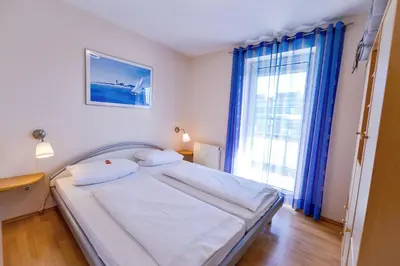 Ein Bett oder Betten in einem Zimmer der Unterkunft Haus Seewind HS20