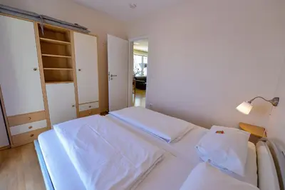 Ein Bett oder Betten in einem Zimmer der Unterkunft Haus Seewind HS20