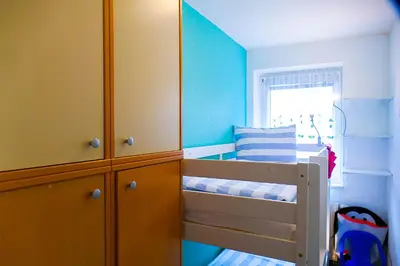 Ein Bett oder Betten in einem Zimmer der Unterkunft Haus Seewind HS07