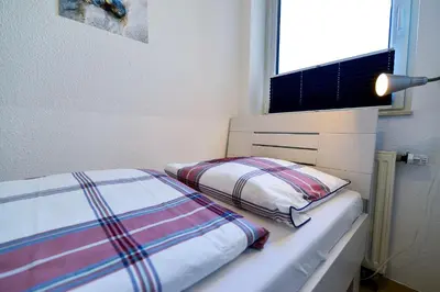 Ein Bett oder Betten in einem Zimmer der Unterkunft Haus Seewind HS13