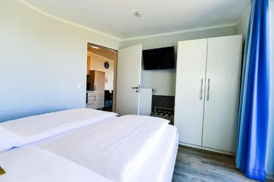 Ein Bett oder Betten in einem Zimmer der Unterkunft Beach Lodge BL04