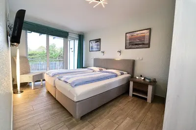 Ein Bett oder Betten in einem Zimmer der Unterkunft Haus Nordseebrandung NC34