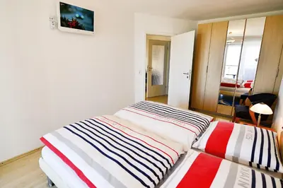 Ein Bett oder Betten in einem Zimmer der Unterkunft Haus Nordseebrandung NC53