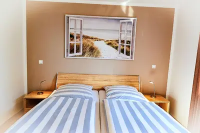 Ein Bett oder Betten in einem Zimmer der Unterkunft Haus Nordseebrandung NC56