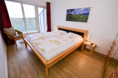 Ein Bett oder Betten in einem Zimmer der Unterkunft Haus Nordseebrandung NC64