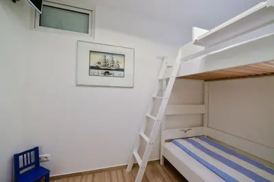 Ein Bett oder Betten in einem Zimmer der Unterkunft Haus Nordseebrandung NC64