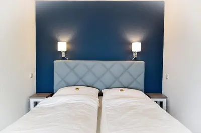 Ein Bett oder Betten in einem Zimmer der Unterkunft Strandhochhaus SHC2
