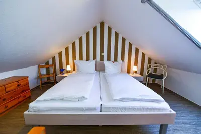 Ein Bett oder Betten in einem Zimmer der Unterkunft Haus Horizont HZ34