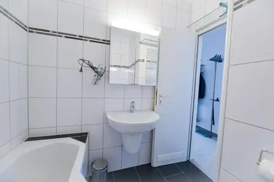 Ein Badezimmer in der Unterkunft Strandhochhaus SF14