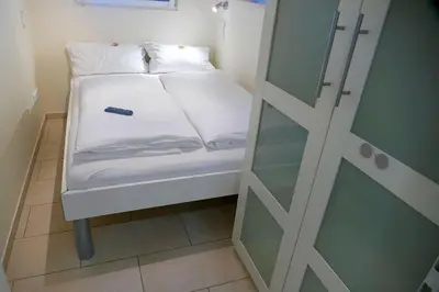 Ein Bett oder Betten in einem Zimmer der Unterkunft Strandhochhaus SG03