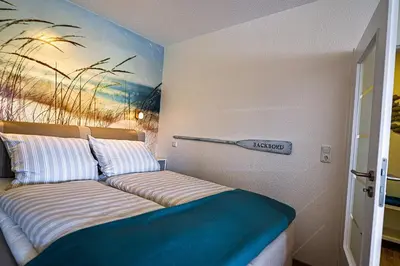 Ein Bett oder Betten in einem Zimmer der Unterkunft Strandhochhaus SHB3