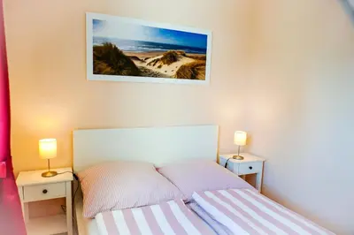 Ein Bett oder Betten in einem Zimmer der Unterkunft Strandhochhaus SD02