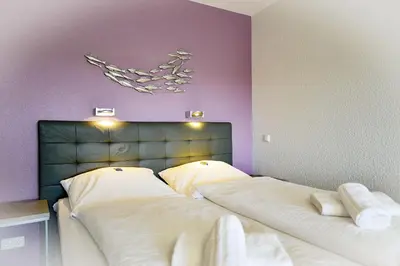 Ein Bett oder Betten in einem Zimmer der Unterkunft Strandhochhaus SHC9