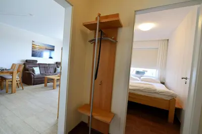 Ein Bett oder Betten in einem Zimmer der Unterkunft Strandhochhaus SHC8