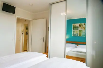 Ein Bett oder Betten in einem Zimmer der Unterkunft Haus Horizont HZ07