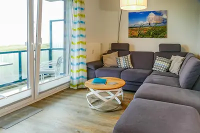 Ein Sitzbereich in der Unterkunft Beach Lodge BL01