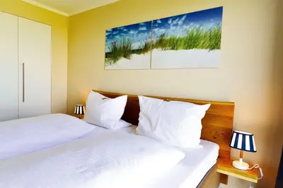 Ein Bett oder Betten in einem Zimmer der Unterkunft Haus Horizont H511