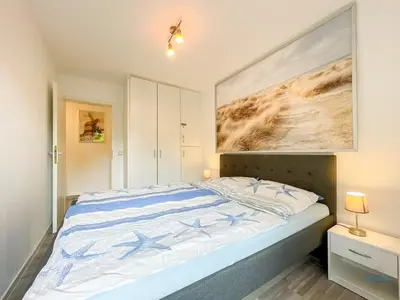Ein Bett oder Betten in einem Zimmer der Unterkunft Haus Elbstrom Döse Whg 11
