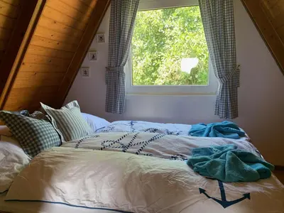 Ein Bett oder Betten in einem Zimmer der Unterkunft Ferienhaus am Meer