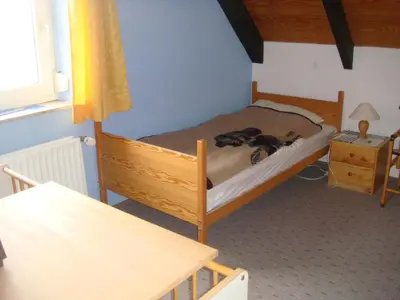Ein Bett oder Betten in einem Zimmer der Unterkunft Fewo Hoogen in Strandnähe