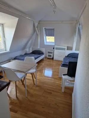 Ein Bett oder Betten in einem Zimmer der Unterkunft Monteurwohnung für 2 Personen inkl. MwSt. - DG Wohnung