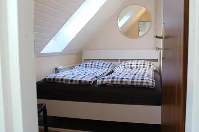 Ein Bett oder Betten in einem Zimmer der Unterkunft Ferienwohnung Krohn Cuxhaven