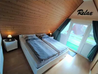 Ein Bett oder Betten in einem Zimmer der Unterkunft Ferienhaus „Buß“