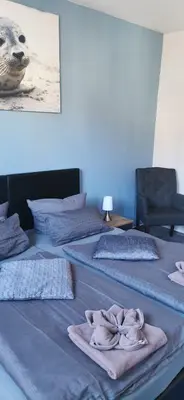 Ein Bett oder Betten in einem Zimmer der Unterkunft Dithmarscher Haus