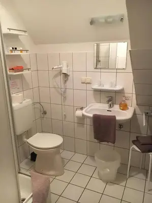 Ein Badezimmer in der Unterkunft Dithmarscher Haus
