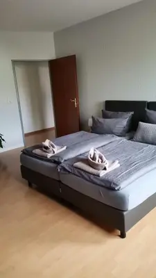Ein Bett oder Betten in einem Zimmer der Unterkunft Dithmarscher Haus