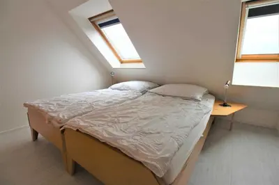 Ein Bett oder Betten in einem Zimmer der Unterkunft Residenz Dünenweg