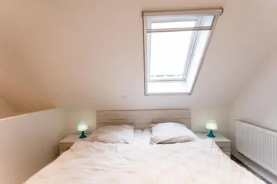 Ein Bett oder Betten in einem Zimmer der Unterkunft Strandbrise