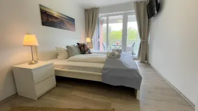 Ein Bett oder Betten in einem Zimmer der Unterkunft Nordseebrandung A1 5